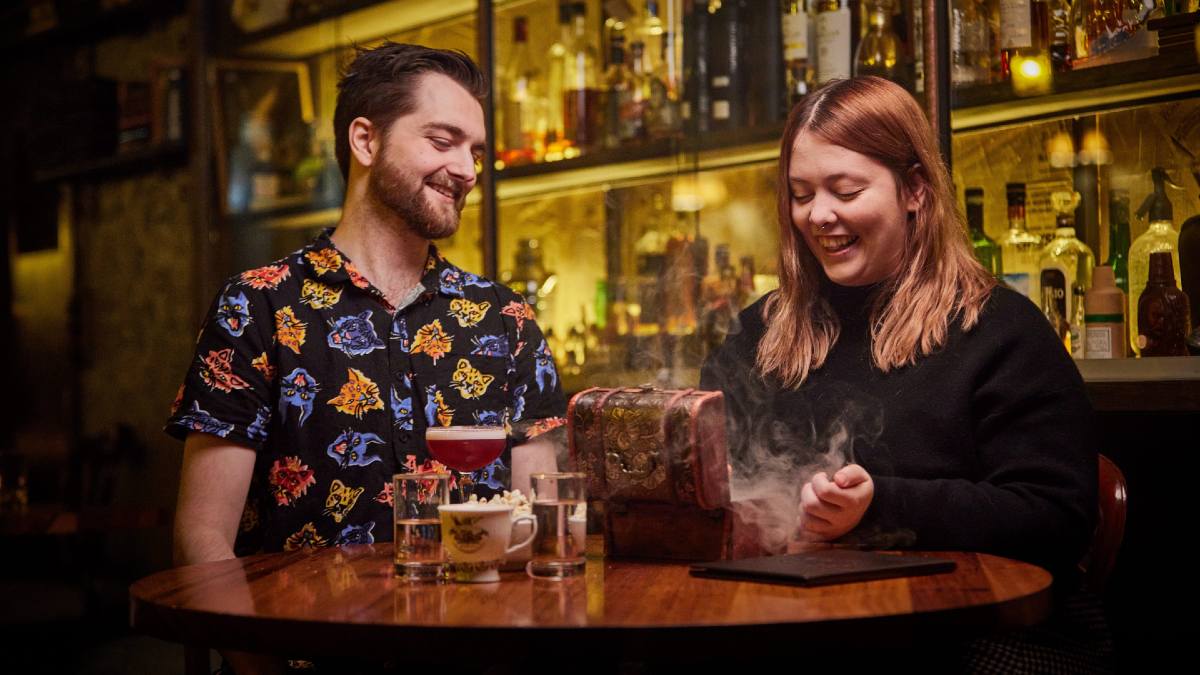young couple enjoying cocktails at 18th Amendment bar in Ballarat