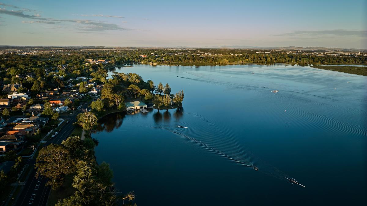 aerial shot of lake and township