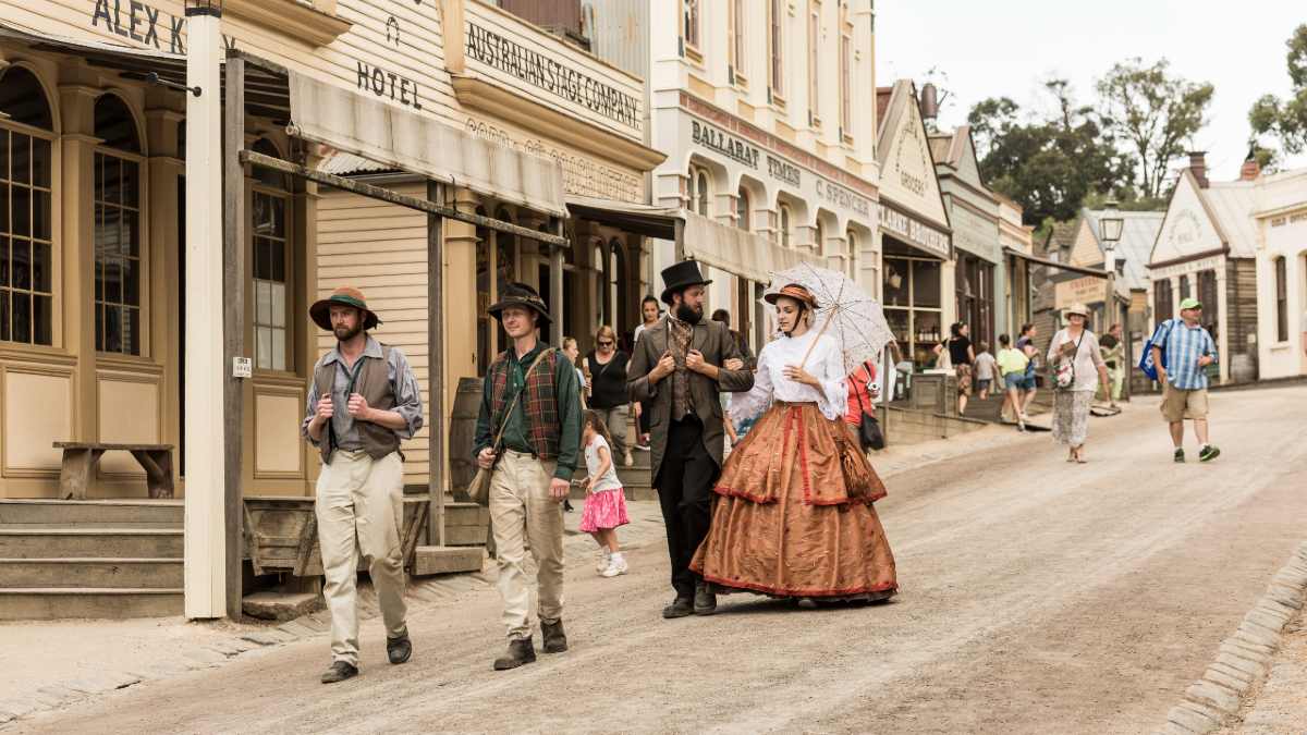 People in period costume walking through the streets of Sovereign Hill