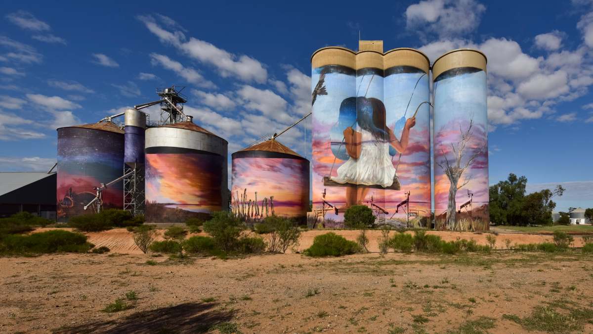 silos with artwork