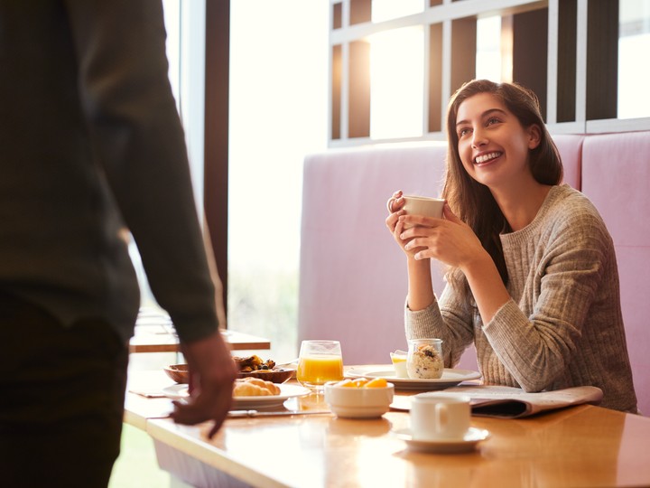 Woman having breakfast at Radius in Inverloch